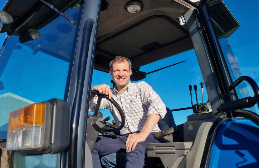 Andrew Bowie MP in a tractor
