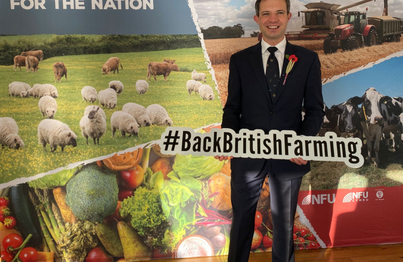 Andrew holding a Back British Farming sign